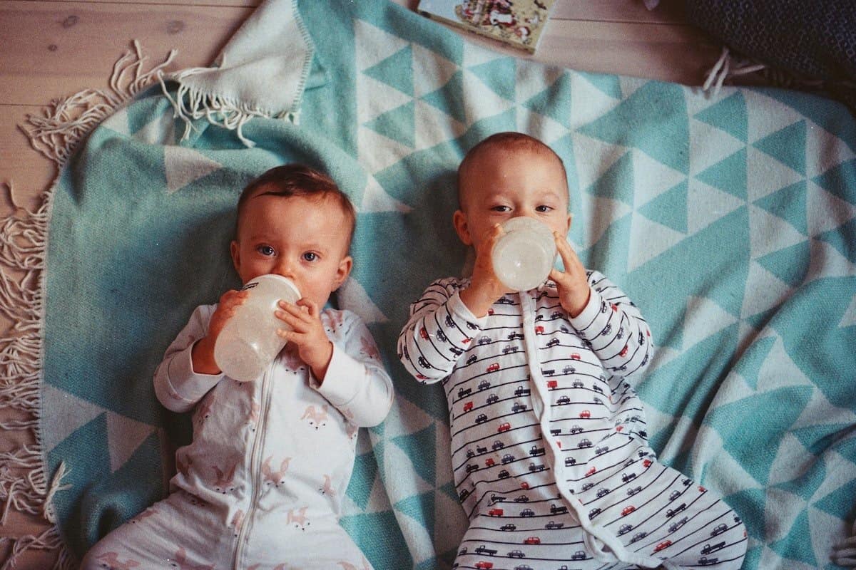 Babies drinking from bottles