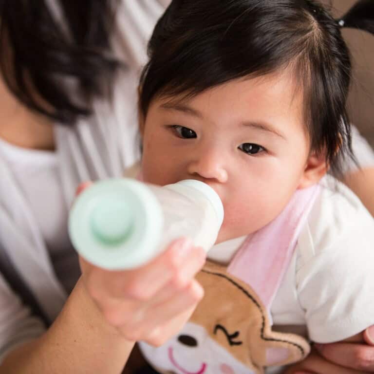 baby drinking from a bottle