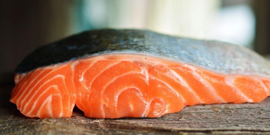 closeup of the grain of a cut salmon steak