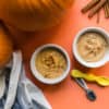 birds eye view of two ramekins of pumpkin pie pudding for babies