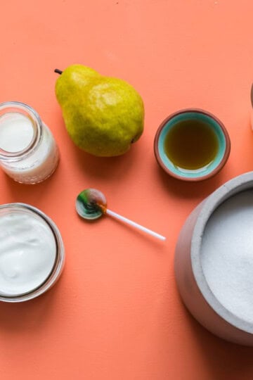 a flatlay image of foods that contain both naturally occurring and refined sources of sugar