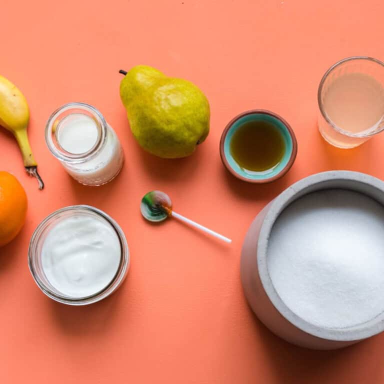 a flatlay image of foods that contain both naturally occurring and refined sources of sugar