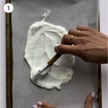 Spreading plain yogurt on baking sheet to make yogurt bark for babies.