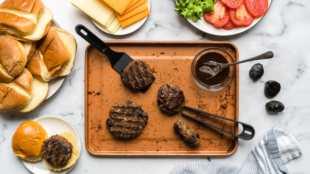 a small baking sheet with burgers made for a baby.