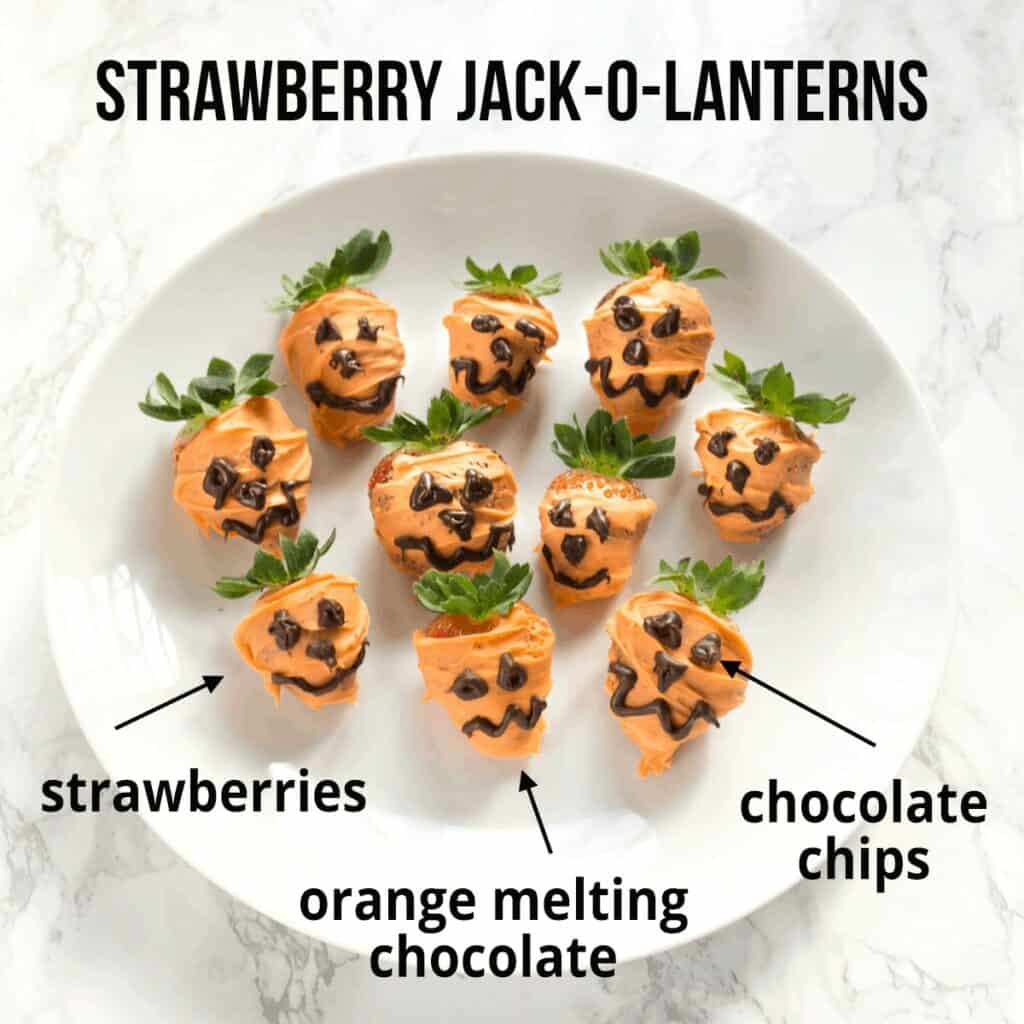 strawberries dipped in orange melting chocolate with black icing piped onto make them look like jack o lanterns