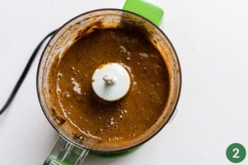 Wet ingredients puréed in a small food processor for homemade baby teething biscuits.