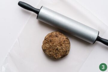 The dough for homemade baby teething cookies ready to be rolled out with a rolling pin.