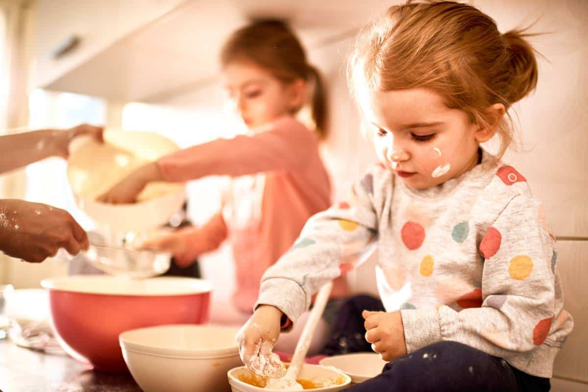 little girls helping to bake