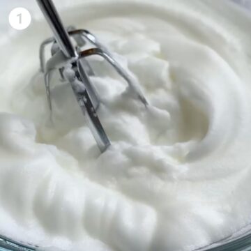 Egg whites whipped to soft peaks.