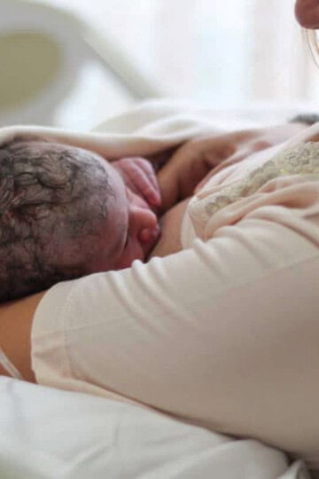 mother is breastfeeding newborn baby