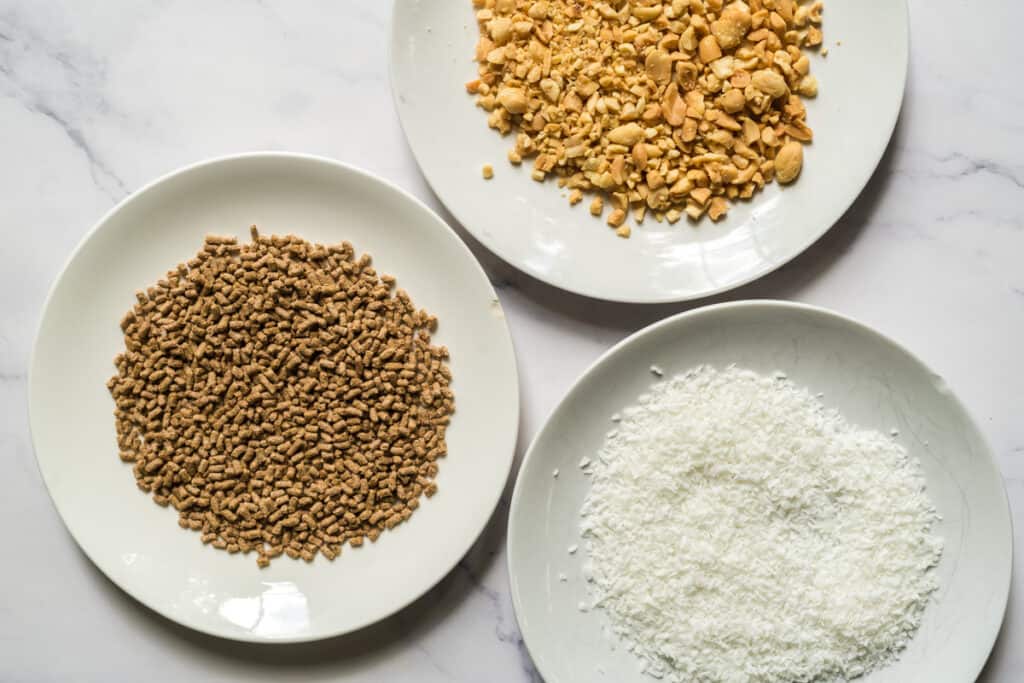 toppings for chocobananos: bran buds, chopped peanuts, and flaked coconut