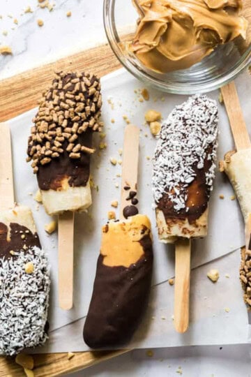 chocobananos with nutritious toppings - bran buds, coconut flakes, and chopped peanuts