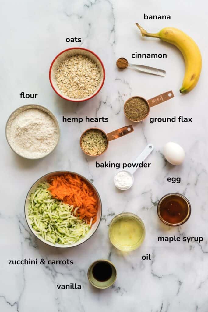 a flatlay image of the ingredients found in banana zucchini carrot muffins