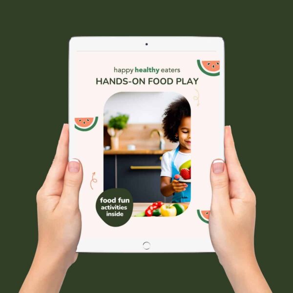 Mockup of two hands holding an ipad with the cover of Hands On Food Play on the screen.