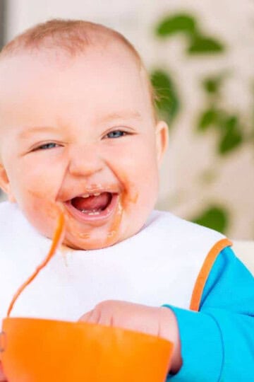 baby eating beans