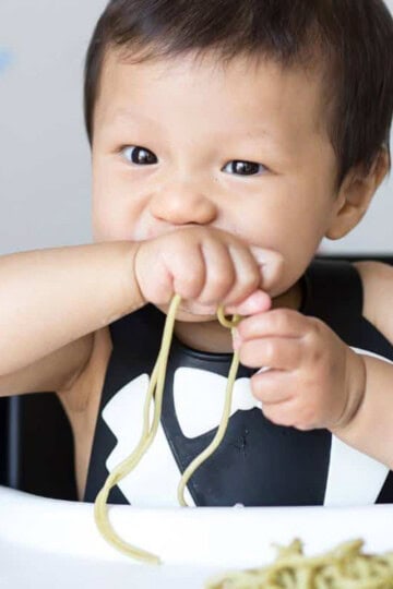 Baby enjoying spaghetti