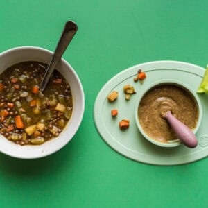A bowl of caldo de lentajas, a Mexican lentil soup, alongside a puréed version for a baby.