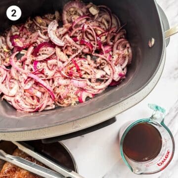 Onions and garlic being sauted in a pot for sumac beef recipe.