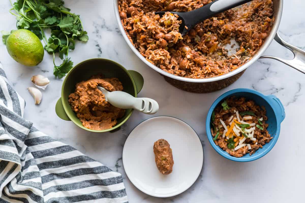 A pot of Sofrito Beef Beans and Rice beside three ways to serve it to a baby - blended, as a rice patty, or for an older baby - as is.