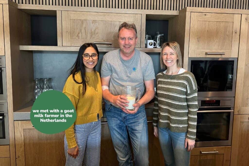 Jess and Nita pose for a photo with a goat farmer they just met in The Netherlands.