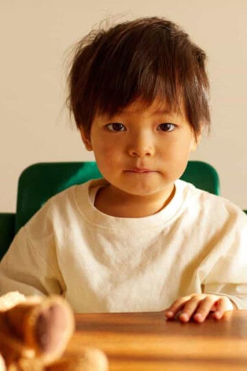 Toddler sitting at table
