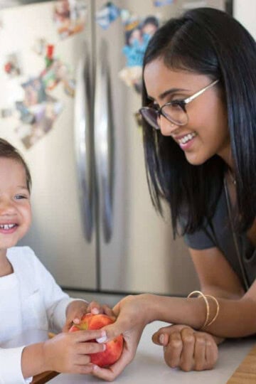Mother in kitchen with toddler.