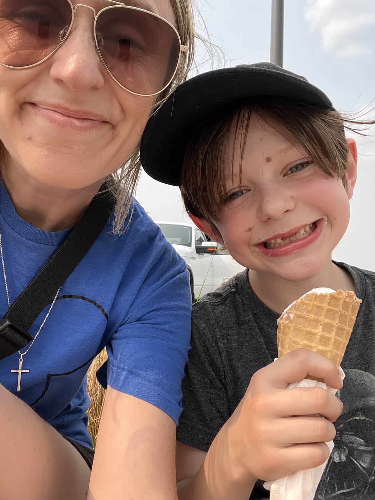 Mom and son enjoying ice cream cones together.