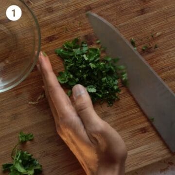 Finely chopping parsley for Italian chicken meatballs for babies.
