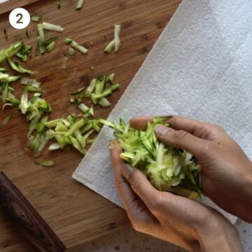 Shredding and removing excess moisture from zucchini for Italian chicken meatballs for babies.