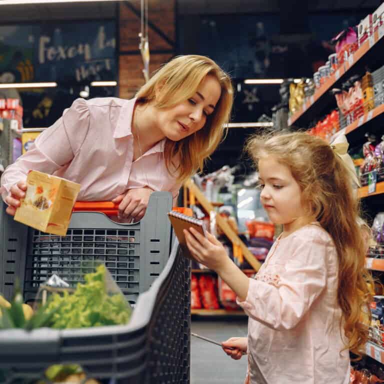 Young girl and mom in grocery store.