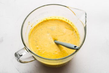 The ingredients for mango chia popsicles stirred together.