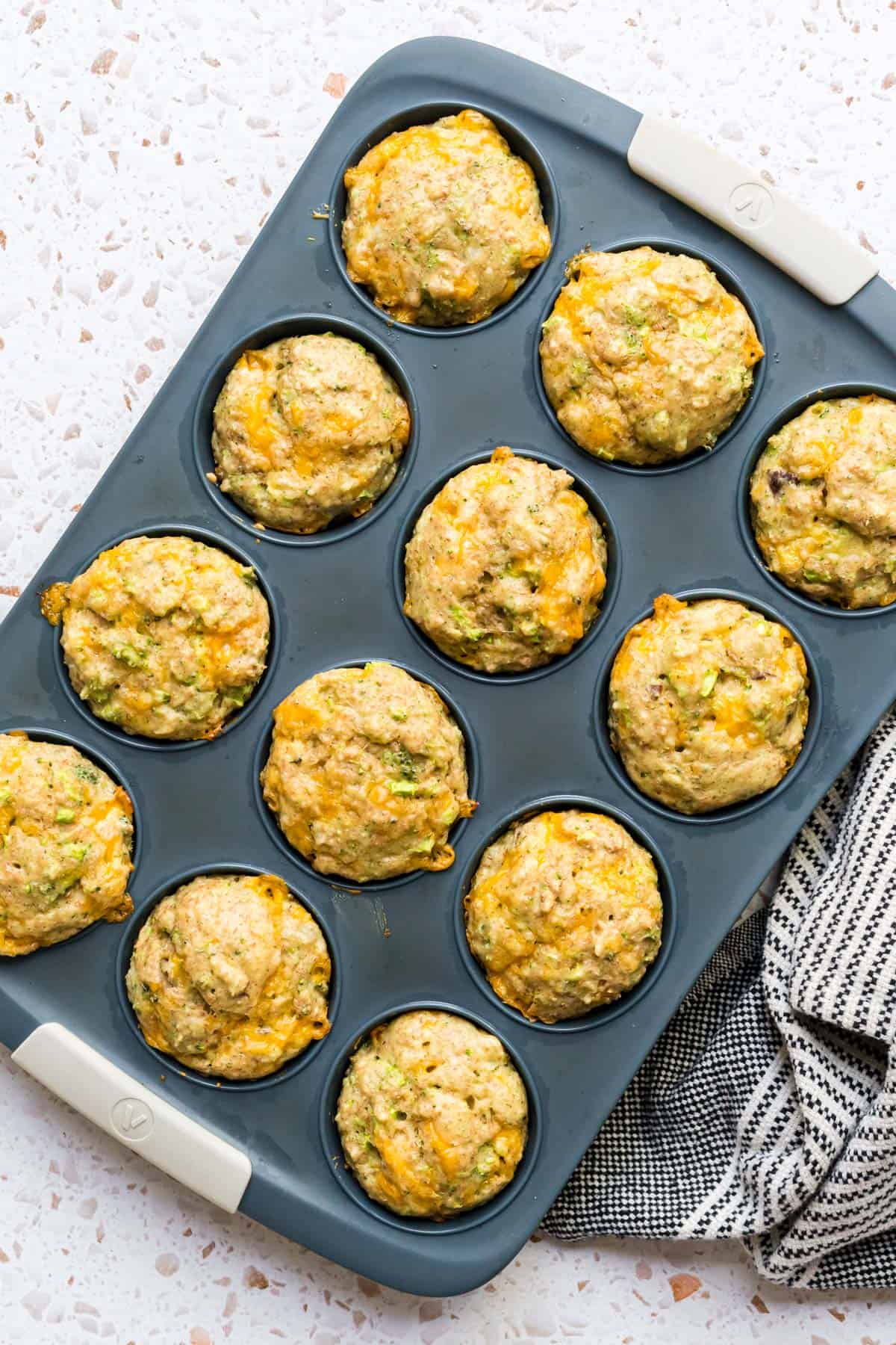 A batch of fluffy cheddar egg muffins in the muffin tin.