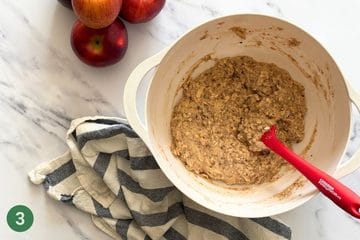 Allowing the batter to rest for five minutes for the perfect healthy applesauce cake crumb.