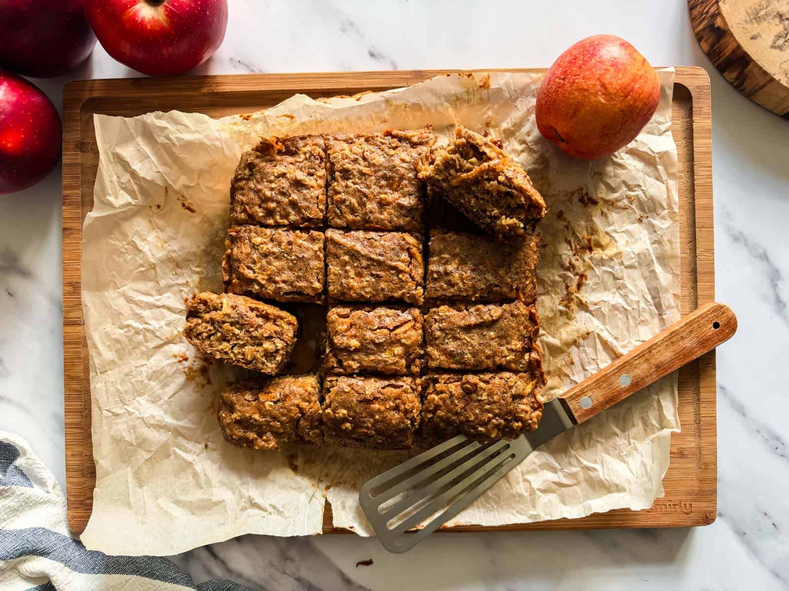 A 9x9 sized healthy applesauce cake cut into 12 servings. 