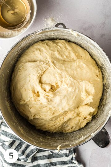 Dough after it has had time to rise in a stand mixer bowl for the mennonite meat buns.